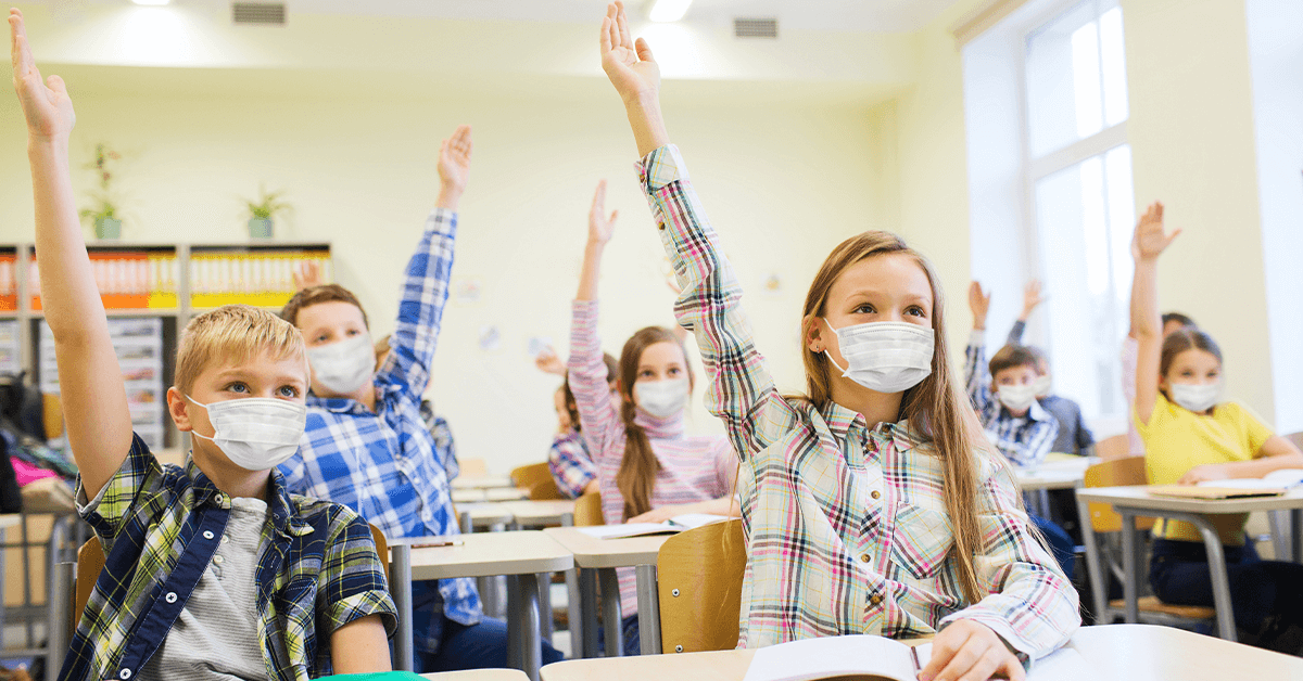 Children in classroom wearing masks
